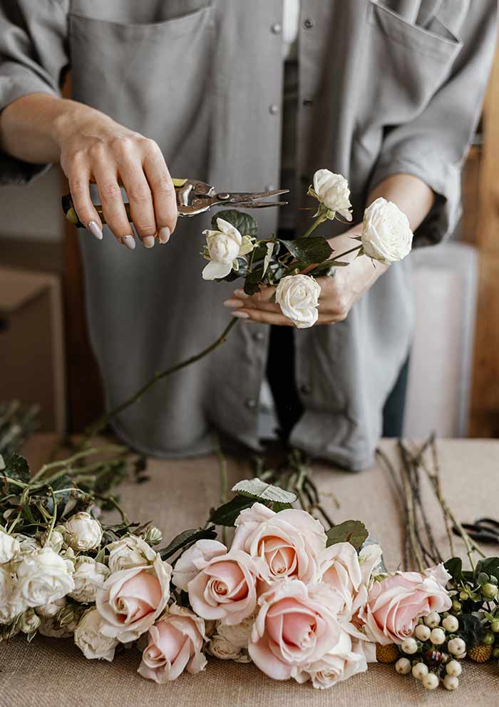 florist making beautiful floral bouquet Footer